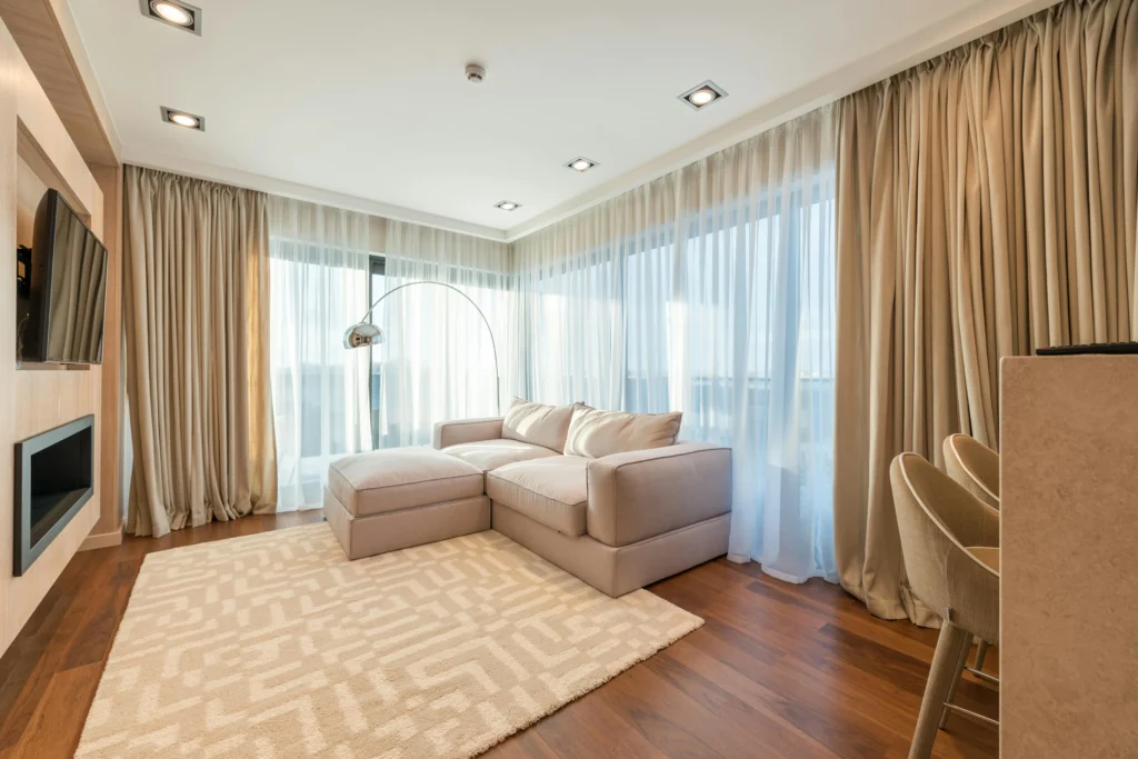 A well-designed custom window treatment for light control, aesthetic, and privacy.