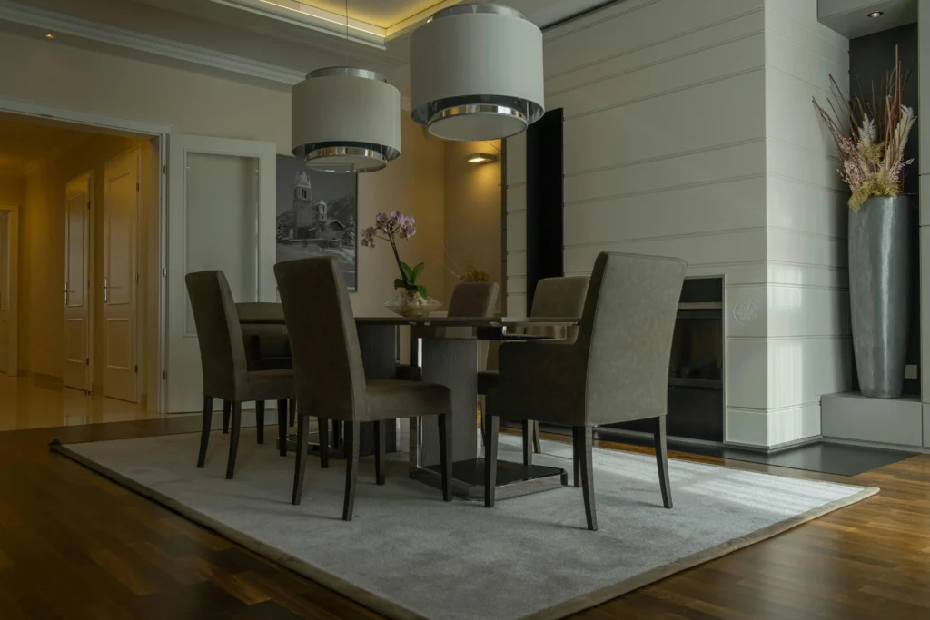 Upgrading dining room with custom rugs.