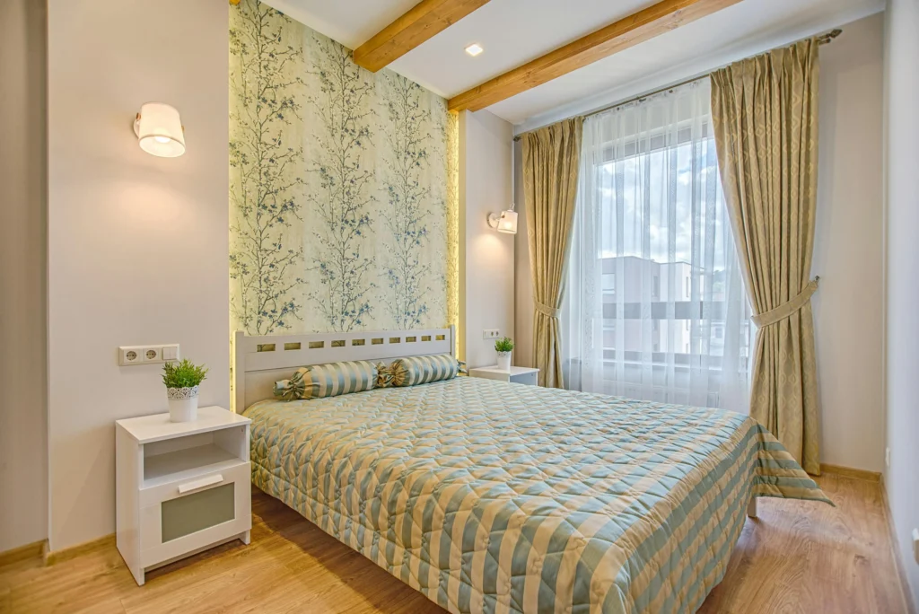 A wallpaper application in a room. Wallpaper vs. Paint: Which is the best for your room?